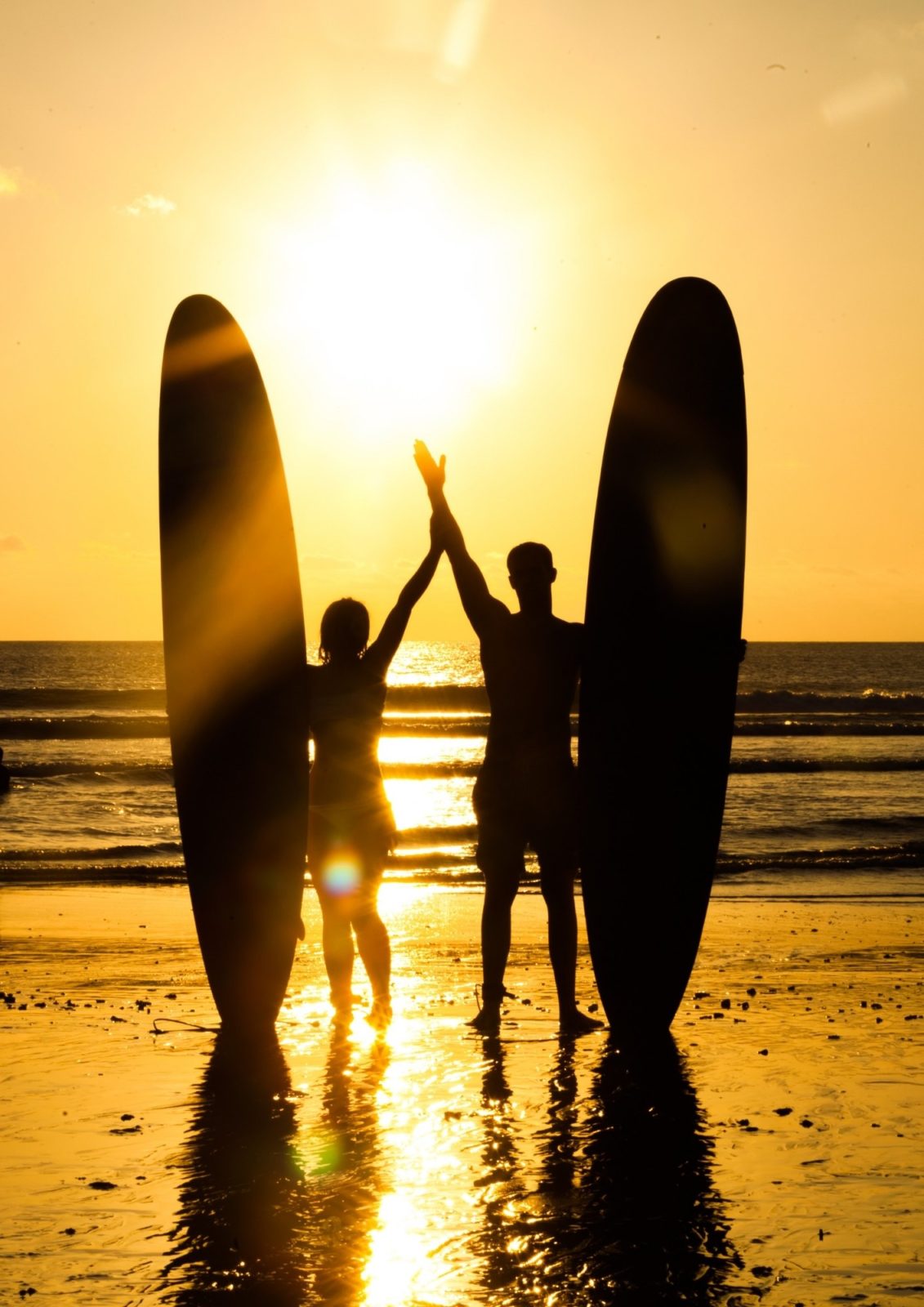 sunset surf couple taghazout beach morocco